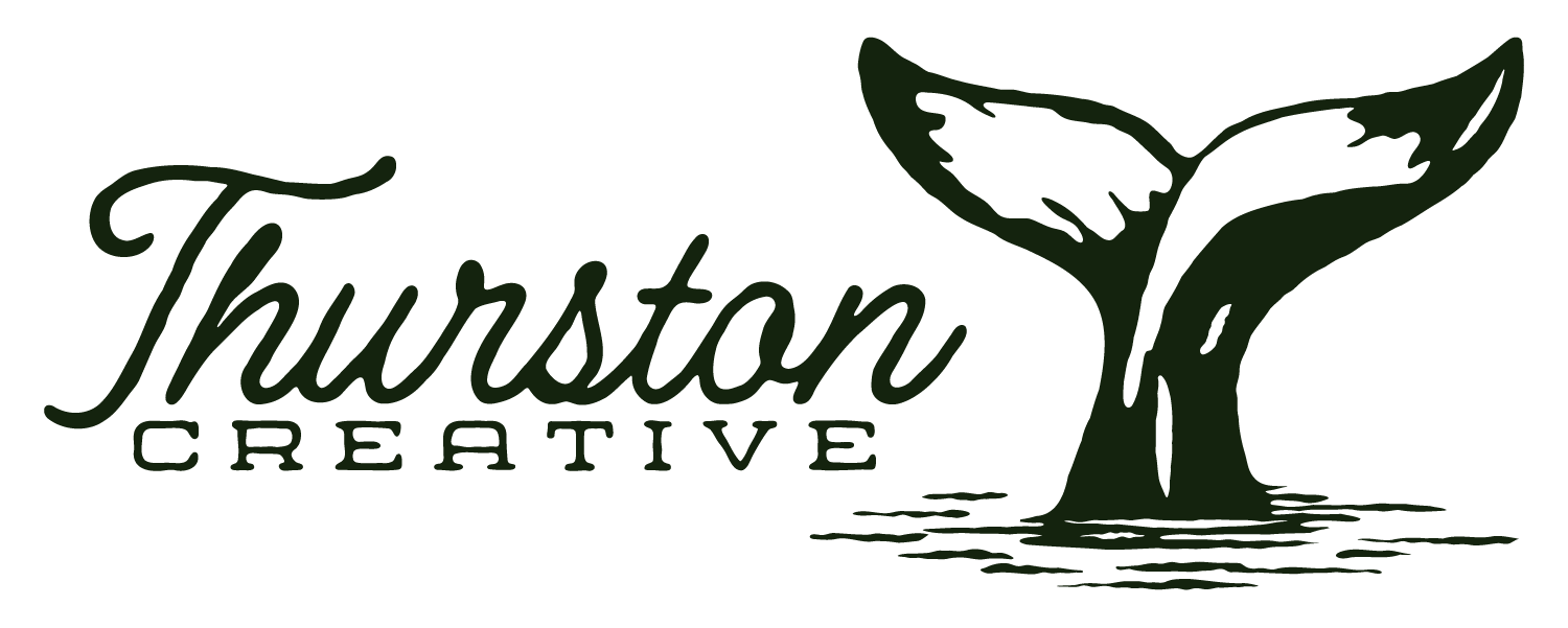 Thurston Creative whale-tail logo